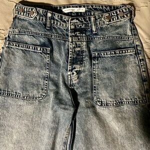 Altar'd State Women's Washed Blue Relaxed Patch Pocket Jeans. Cropped jeans